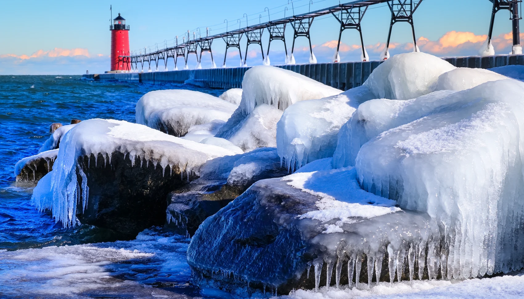 Winter shoreline artwork in blue ice and warm evening light